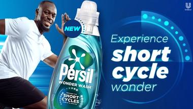 Werbebild von Usain Bolt und Persil Wonder Wash und dem Text ‘Erleben Sie ein Kurzzeitwunder’.