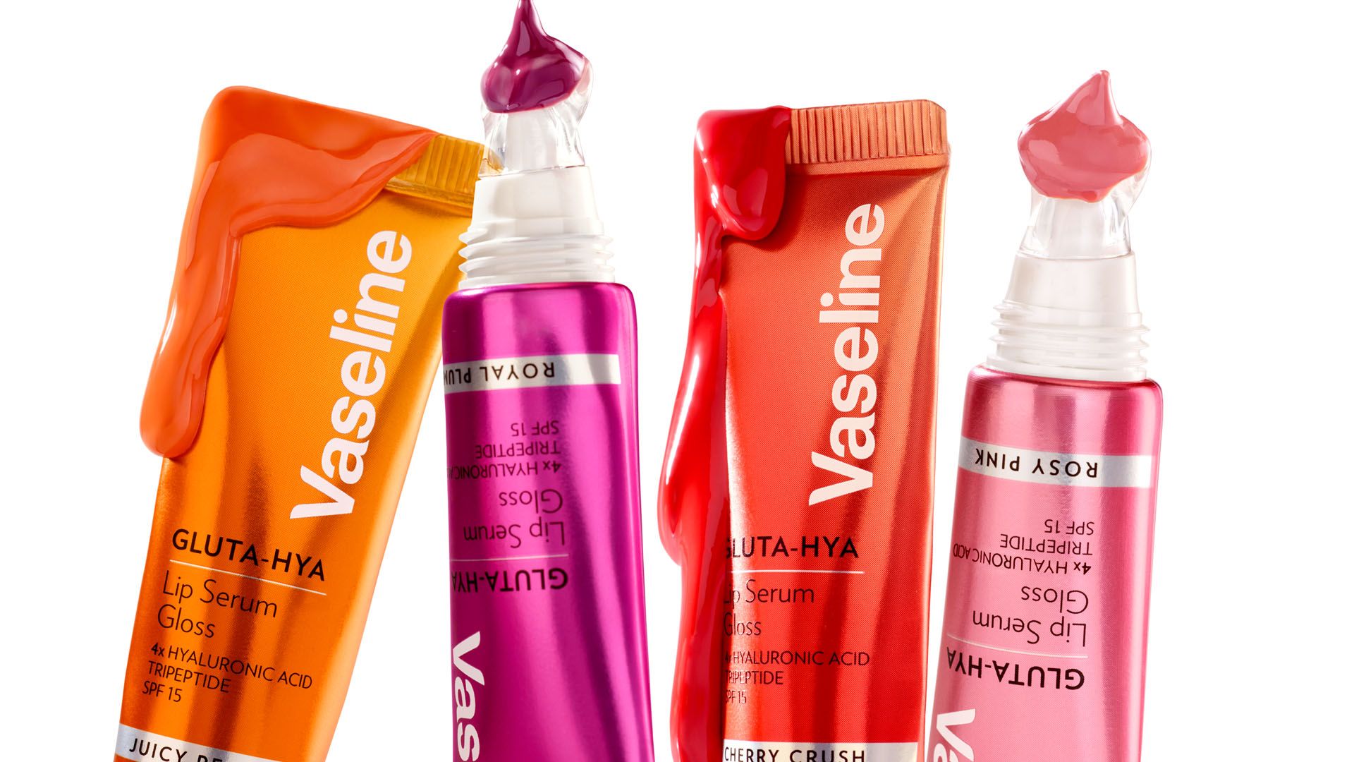 Vier Produkte aus dem Gluta-Hya-Lippensortiment von Vaseline. Die Verpackung ist rot und rosa vor weißem Hintergrund.